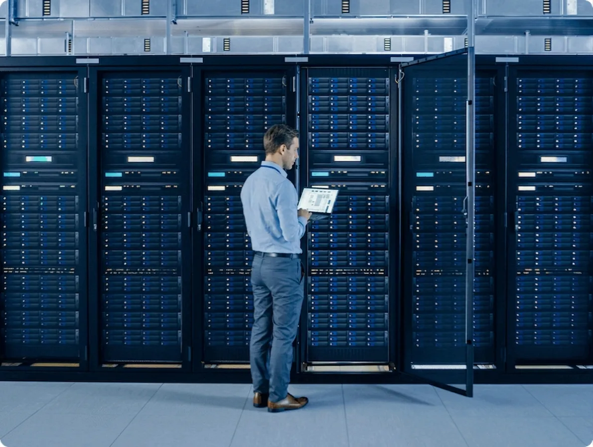 Technician with a laptop in a secure data center